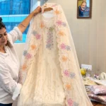 Ivory crushed tissue suit set with multicolour floral embroidery and matching dupatta